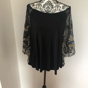 Black shirt with black and blue lace sleeves